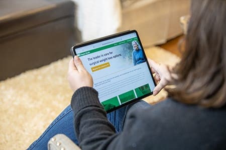 Woman looking at tablet device
