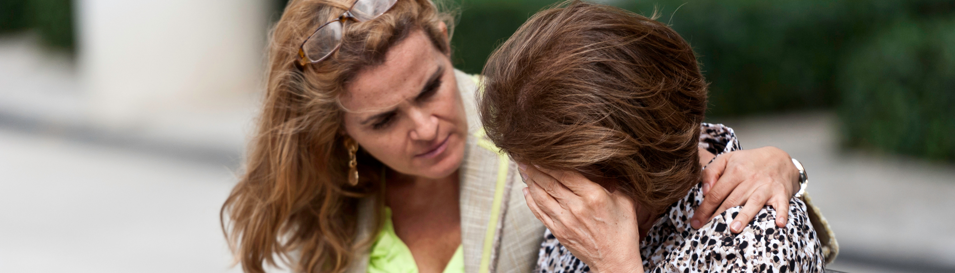 One woman comforting a crying woman